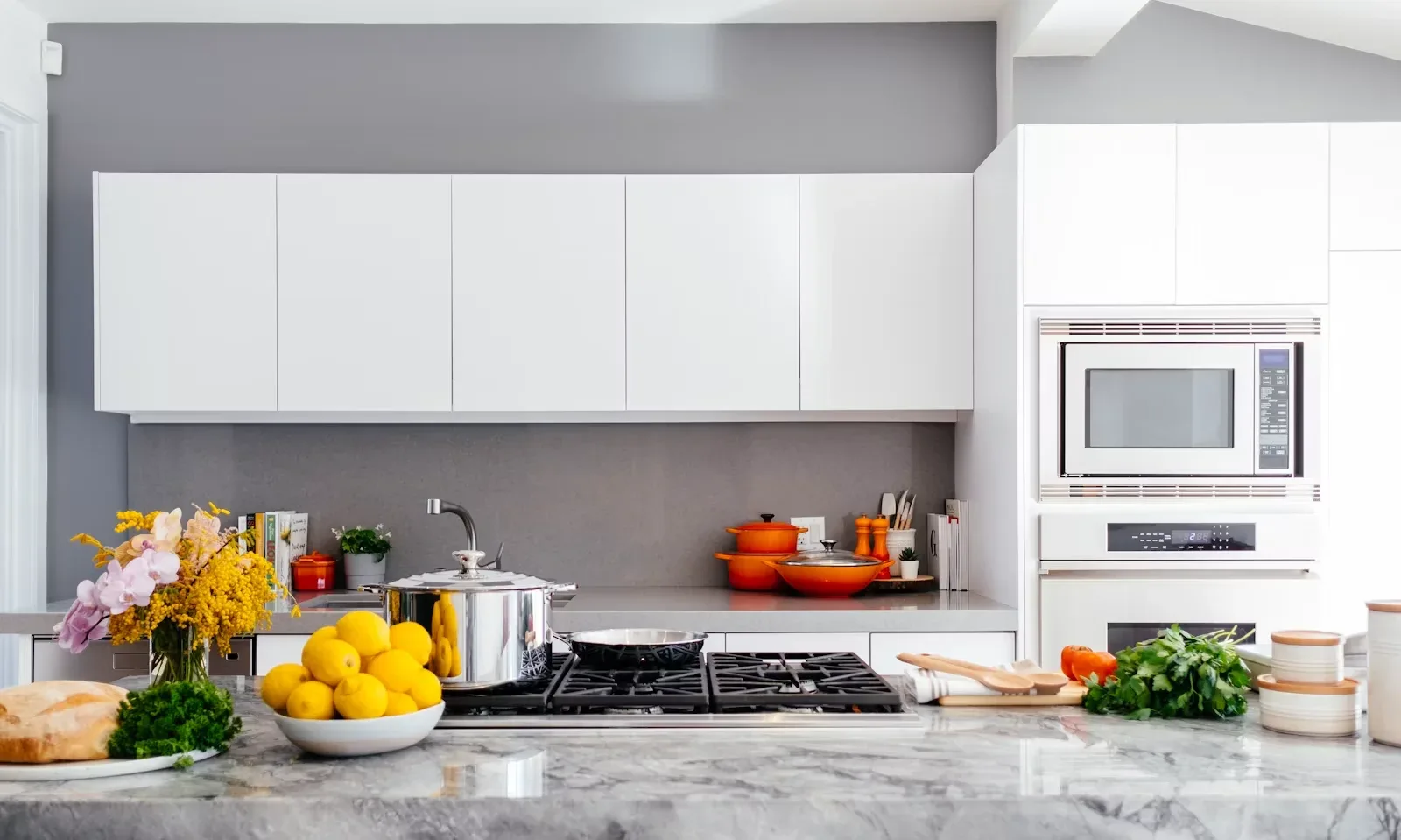 Appliance repair technician working in a Syracuse kitchen