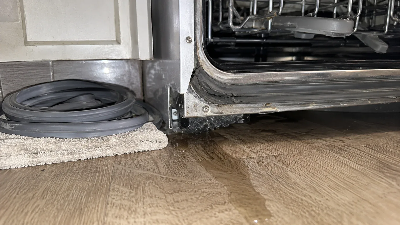 Dishwasher door leaking onto a new kitchen floor