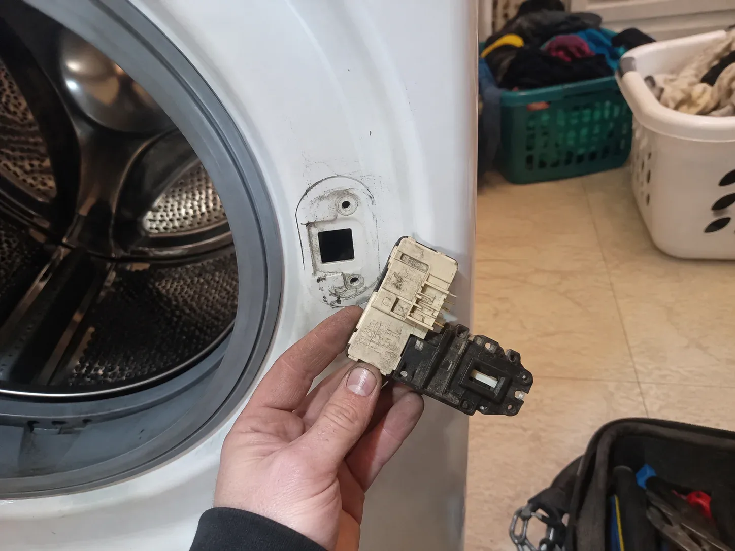 Front-load washer door locked shut after a cycle